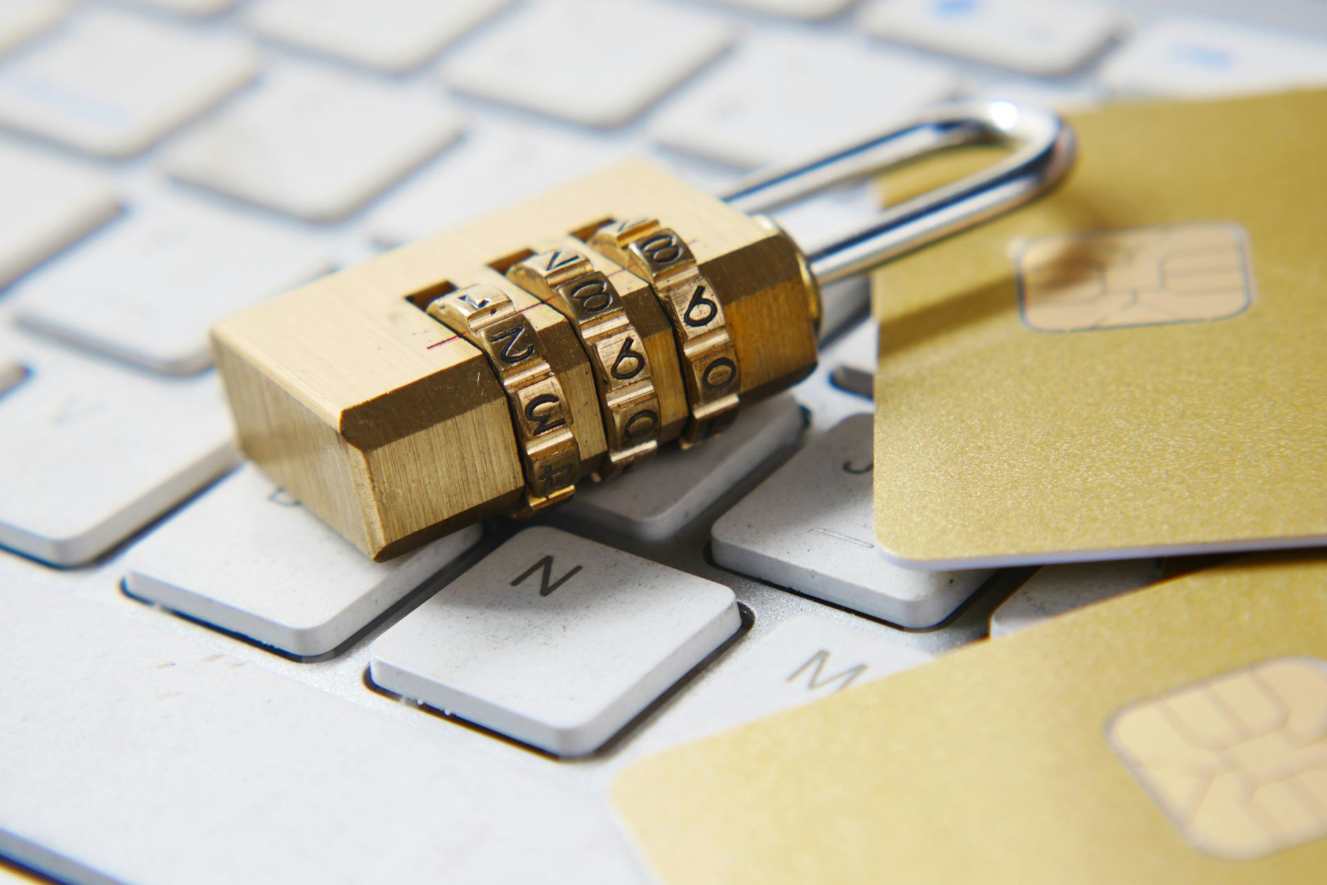 a combination lock on top of a computer keyboard
