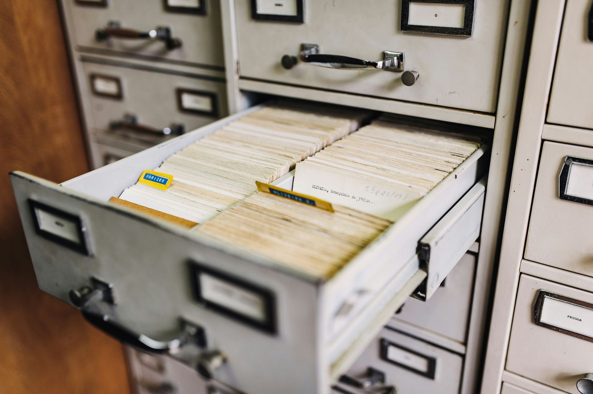 a filing cabinet with the open drawers