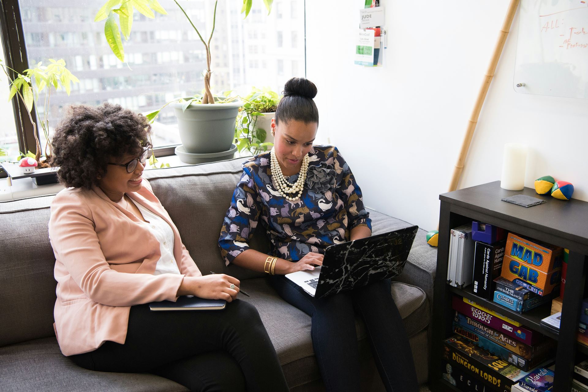 Two women looking at a computer